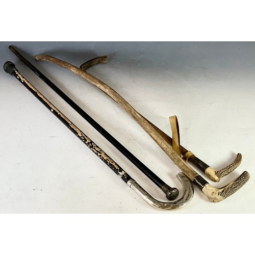 413 - THREE STICKS WITH SILVER MOUNTS AND A RIDING CROP WITH SILVER MOUNT