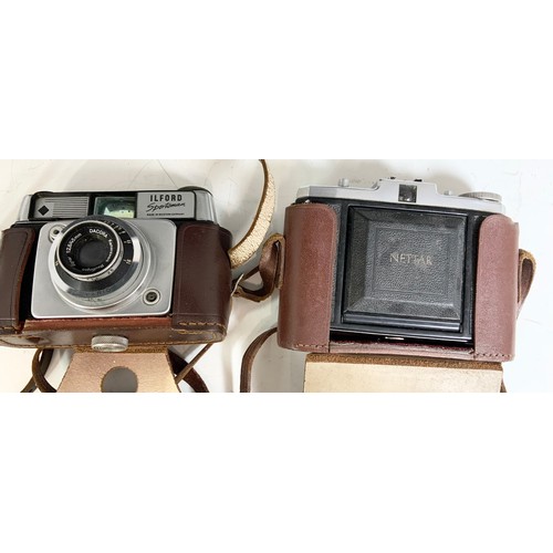 464 - A COLLECTION OF OLD CAMERAS INCLUDING AN ILFORD SPORTSMAN, A NETTAR ZEISS IKON AND A BROWNIE TWIN 20... 