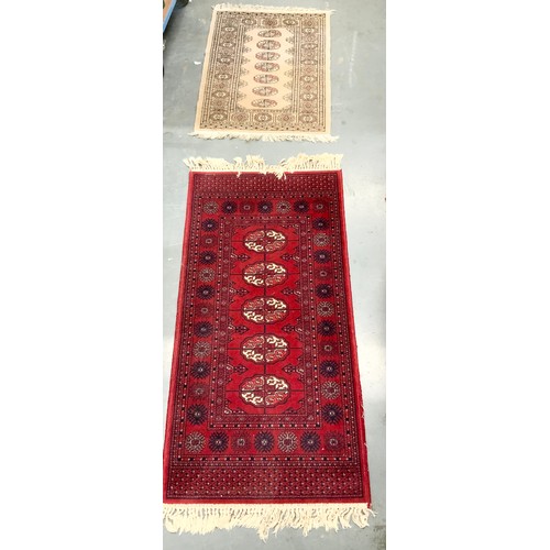 743 - RED GROUND RUG MACHINE NADE 136cm x 69cm & A CREAM GROUND RUG PAKISTAN BOKHARA 87cm x 66cm