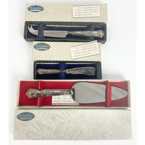 324 - BOXED STERLING SILVER HANDLED CAKE SLICE, CHEESE KNIFE AND A BUTTER KNIFE