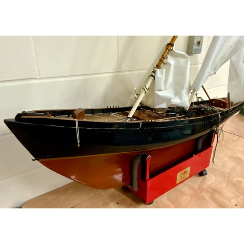 86 - RADIO CONTROLLED ‘A’ CLASS RACING YACHT, APPROX 160 CM LONG, ON WHEELED BASE