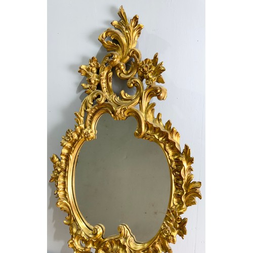 63 - ORNATE GILT FRAMED MIRROR 114cm x 62cm