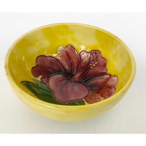 134 - MOORCROFT POTTERY BOWL YELLOW GROUND BOWL DECORATED WITH THE HIBISCUS PATTERN 11cm DIAMETER