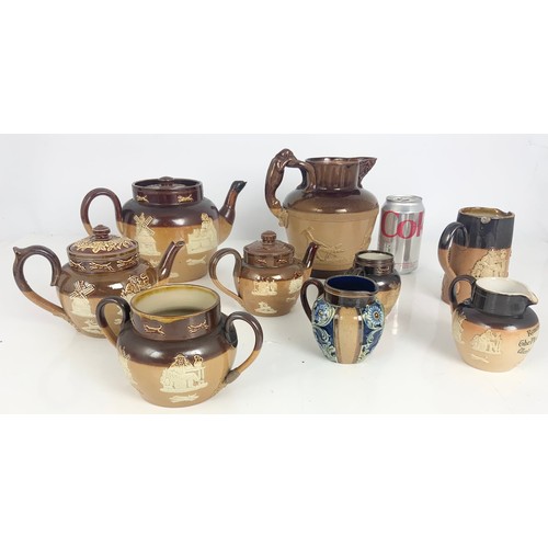 208 - A COLLECTION OF SALT GLAZED ROYAL DOULTON TEAPOTS AND JUGS ETC