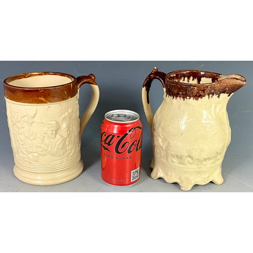 205 - CREAM GLAZED RELIEF DECORATED STONEWARE TANKARD AND JUG