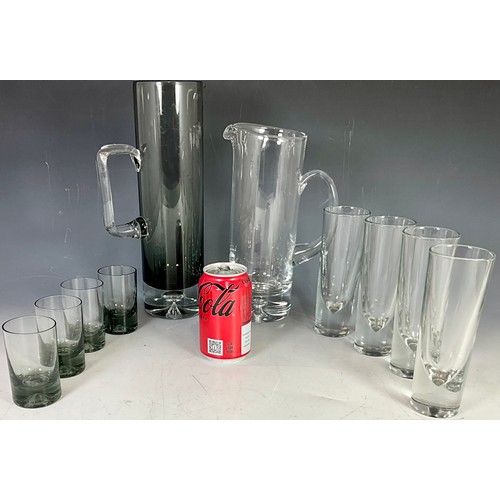 242 - HEAVY SMOKED GLASS TALL PITCHER AND 4 GLASSES PLUS A CLEAR TALL GLASS PITCHER AND 4 ITALIAN TUMBLERS