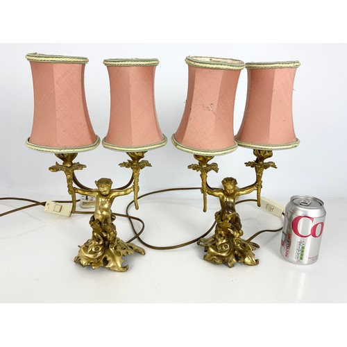 262 - PAIR OF GILT METAL CHERUB / FAWN DOUBLE TABLE LAMPS. Note: Both lamps failed PAT safety test. Will r... 