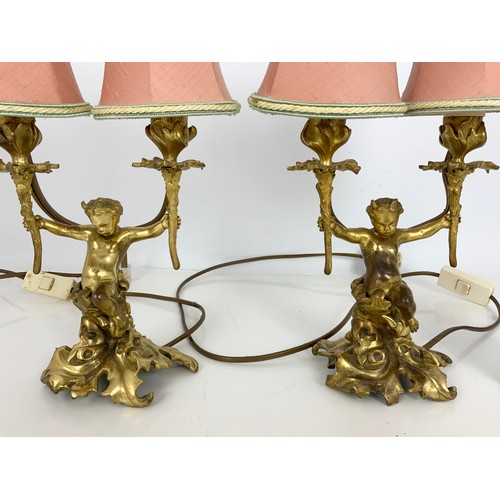 262 - PAIR OF GILT METAL CHERUB / FAWN DOUBLE TABLE LAMPS. Note: Both lamps failed PAT safety test. Will r... 