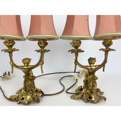 262 - PAIR OF GILT METAL CHERUB / FAWN DOUBLE TABLE LAMPS. Note: Both lamps failed PAT safety test. Will r... 