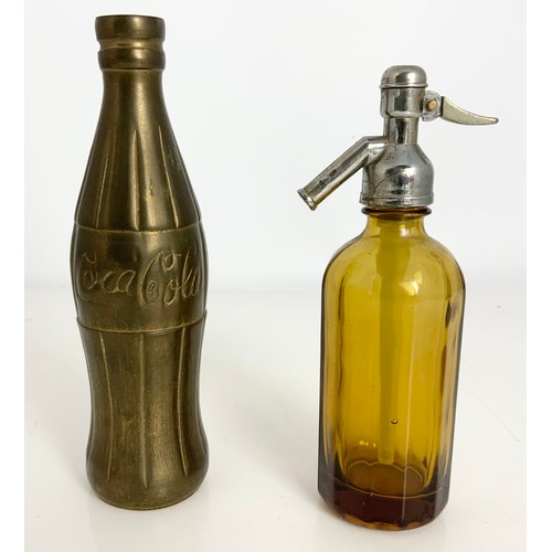 318 - A BRASS MINIATURE COCA COLA BOTTLE  18cm TALL AND A MINIATURE AMBER GLASS SODA SYPHON