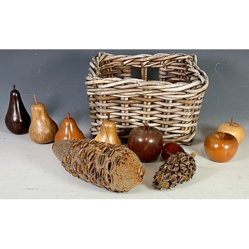 343 - WICKER BASKET CONTAINING CARVED WOODEN FRUIT