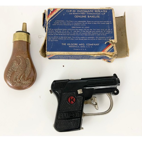 373 - COLTS PATENT POWDER FLASK AND A KILGORE USA TOY PAPER CAP PISTOL IN BOX