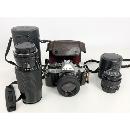 422 - CANON AE-1 SLR CAMERA WITH LENSES