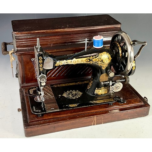 481 - TWO CASED SINGER SEWING MACHINES, ONE WITH KEY. SERIAL NUMBERS 13222312 & EH809169