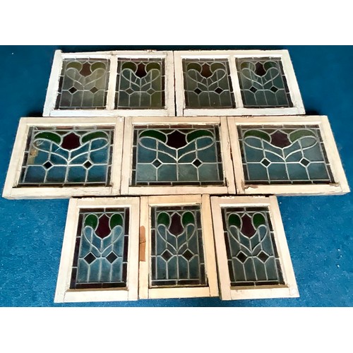 62 - 8 STAINED LEADED GLASS PANELS IN FRAMES. Largest panel 50 x 39cm approx.