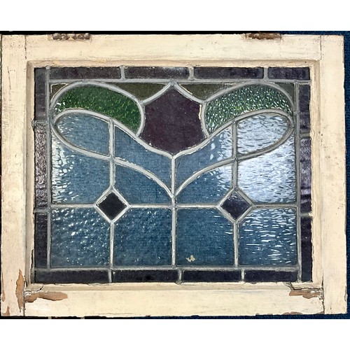 62 - 8 STAINED LEADED GLASS PANELS IN FRAMES. Largest panel 50 x 39cm approx.