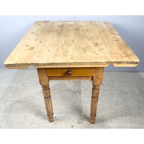 552 - STRIPPED PINE DROP LEAF KITCHEN TABLE WITH SINGLE DRAWER 83cm x 89cm EXTENDED