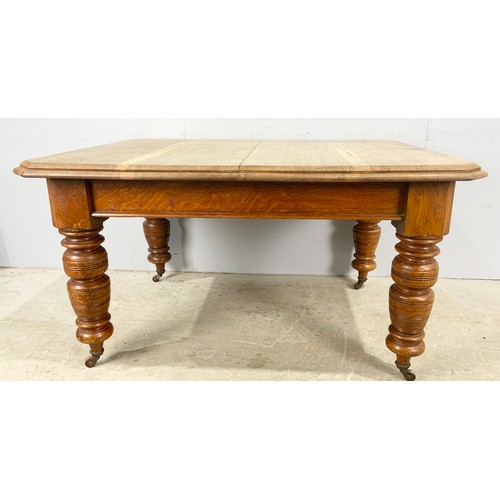 540 - OAK WIND OUT DINING TABLE WITH TWO LEAVES ON TURNED LEGS 223cm x  106cm EXTENDED