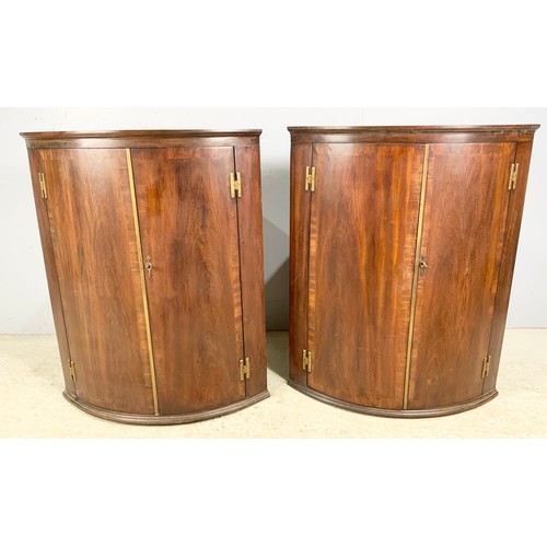 547 - PAIR OF BOW FRONT MAHOGANY HANGING CORNER CUPBOARDS 94cm TALL