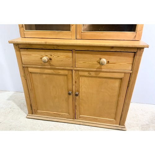 558 - PINE DRESSER WITH GLAZED CABINET ABOVE 117cm. 202cm TALL