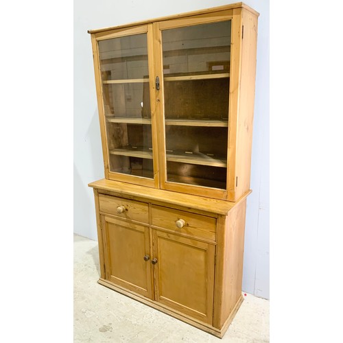 558 - PINE DRESSER WITH GLAZED CABINET ABOVE 117cm. 202cm TALL