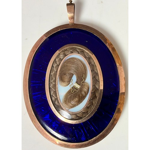 4 - GEORGIAN ROSE GOLD AND COBALT ENAMEL HAIR PENDANT WITH WATERCOLOUR OF A GENTLEMAN MOUNTED IN ORNATE ... 