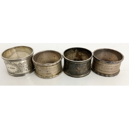 146 - PAIR OF WHITE METAL SALTS, ONE WITH GLASS LINER TOGETHER WITH FOUR SILVER SERVIETTE RINGS 85g