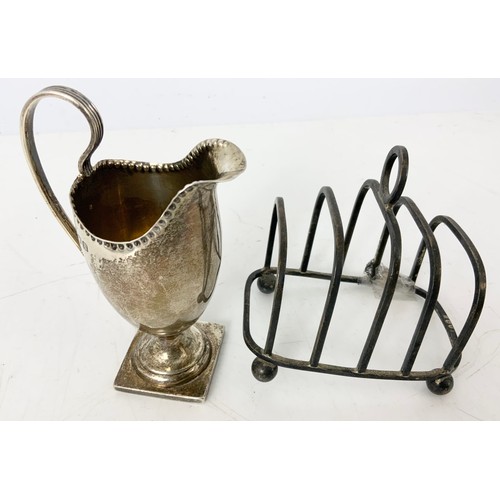 234 - HALLMARKED SILVER 5 BAR TOAST RACK AF & HELMET SHAPED CREAM JUG WITH REPAIR  154g