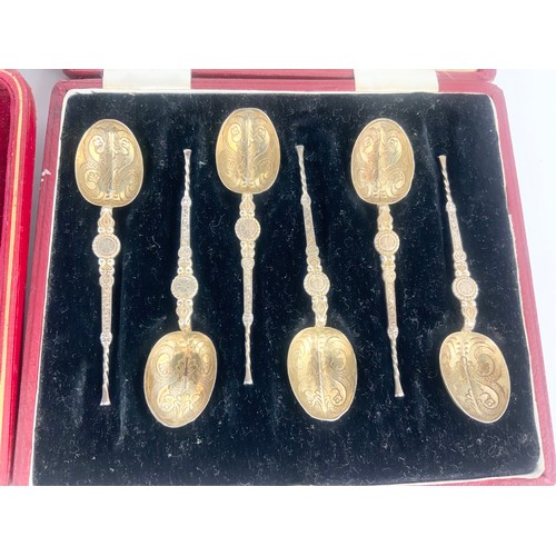 208 - TWO CASED SILVER COMMEMORATIVE SETS OF SIX TEASPOONS MODELLED AS ANOINTING SPOONS