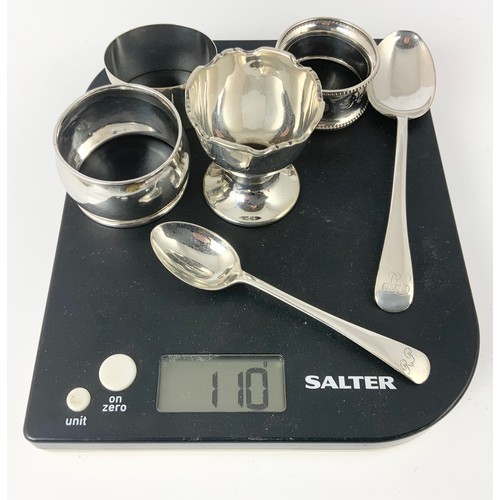 152 - SILVER SERVIETTE RINGS, EGG CUP AND 2 SILVER TEA SPOONS, APPROX. 110g