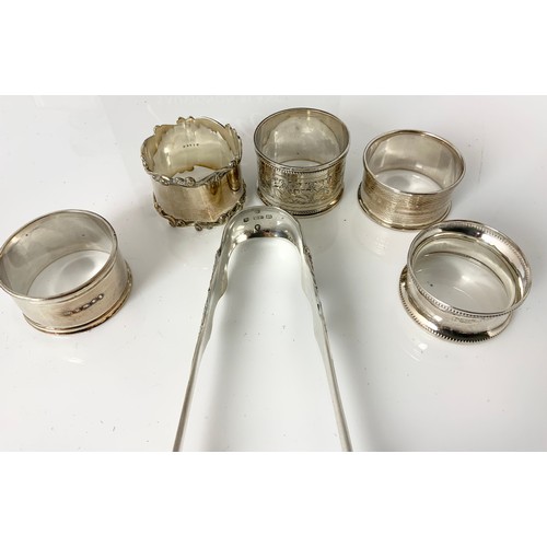 159 - 5 SILVER NAPKIN RINGS AND  RARE GLASGOW  1865 SILVER SUGAR TONGS 159g