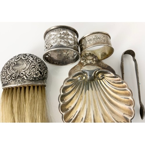 155 - MISC. SILVER TO INC. SCALLOP DISH, 2 SERVIETTE RINGS AND TONGS, APPROX. 104g TOGETHER WITH A SILVER ... 