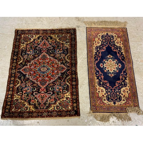 695 - 2 BLUE GROUND RUGS  LARGEST 150cm x 110cm