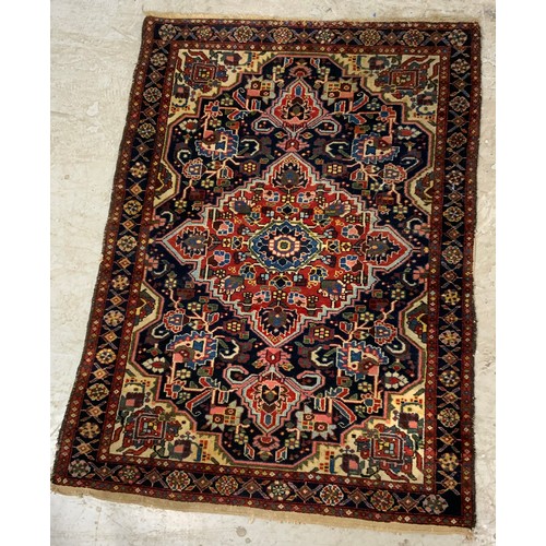 695 - 2 BLUE GROUND RUGS  LARGEST 150cm x 110cm