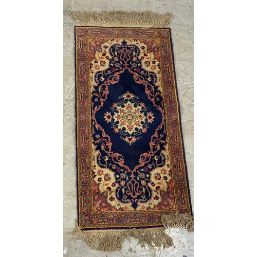 695 - 2 BLUE GROUND RUGS  LARGEST 150cm x 110cm