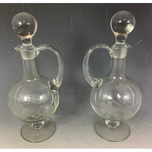 239 - PAIR OF ETCHED GLASS CLARET JUGS