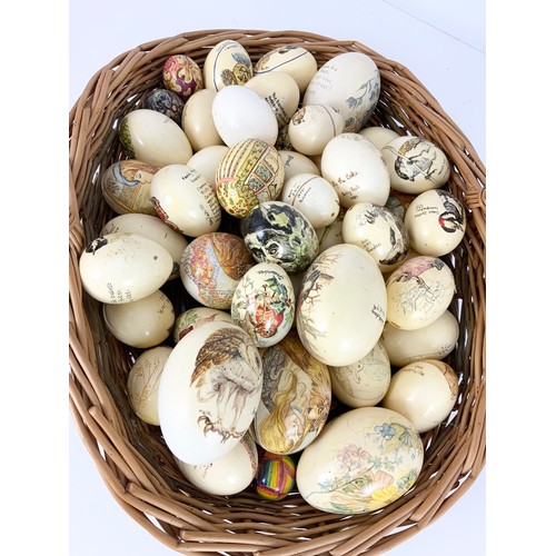 375 - LARGE QUANTITY OF PAINTED EGGS IN A BASKET