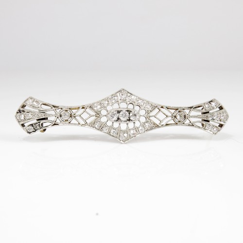 687 - LOVELY DIAMOND SET ART DECO BROOCH IN THE FORM OF AN ELONGATED BOW, APPROX. 6.5 cm