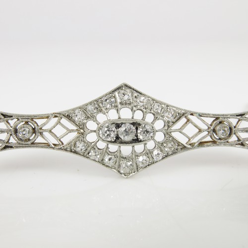 687 - LOVELY DIAMOND SET ART DECO BROOCH IN THE FORM OF AN ELONGATED BOW, APPROX. 6.5 cm