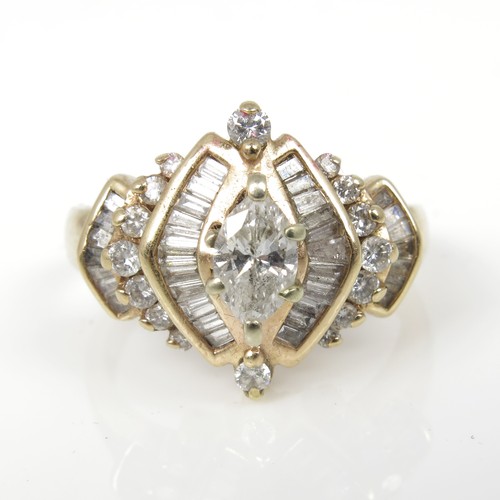 677 - AN IMPRESSIVE DIAMOND CLUSTER RING WITH A CENTRAL MARQUISE CUT STONE IN A SETTING WITH BAGUETTE AND ... 