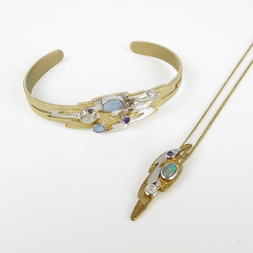 572 - MODERNIST 9CT GOLD BANGLE AND MATCHING PENDANT SET WITH CABOCHON OPALS, MOONSTONES AND AMETHYSTS