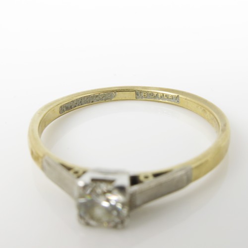 657 - 18CT GOLD AND PLATINUM DIAMOND SOLITAIRE