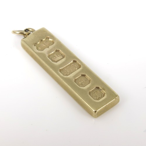 583 - 9CT GOLD INGOT PENDANT, APPROX. 7.4g