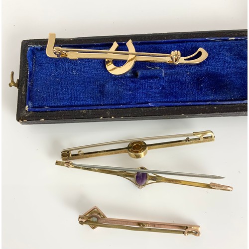 597 - 3 GOLD BAR BROOCHES AND AN UNMARKED CROP PIN