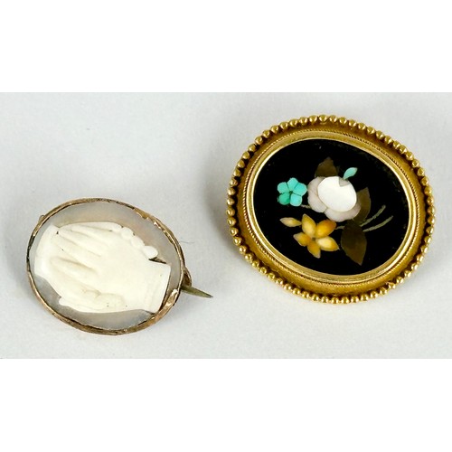 553 - 2 INTERESTING BROOCHES, ONE SET WITH AN OVAL PIETRA DURA PANEL THE OTHER AN OVAL CAMEO DEPICTING CLA... 