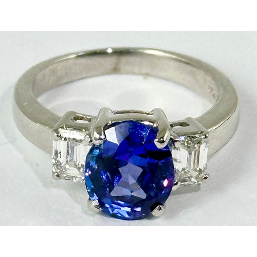 679 - TANZANITE AND DIAMOND RING, OVAL TANZANITE APPROX. 4CTS WITH BAGUETTE DIAMONDS TO THE SHOULDER, EACH... 