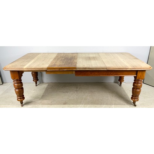 1540 - OAK WIND OUT DINING TABLE WITH TWO LEAVES ON TURNED LEGS 223cm x  106cm EXTENDED