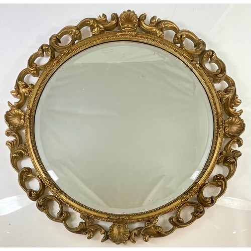 64 - ORNATE GILT FRAMED ROUND BEVEL EDGED MIRROR. 42cm Dia.