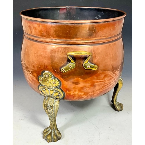 323 - LARGE COPPER COAL SCUTTLE OR PLANTER WITH BRASS HANDLES ON BRASS TRIPOD CLAW FEET WITH SCROLLWORK LE... 