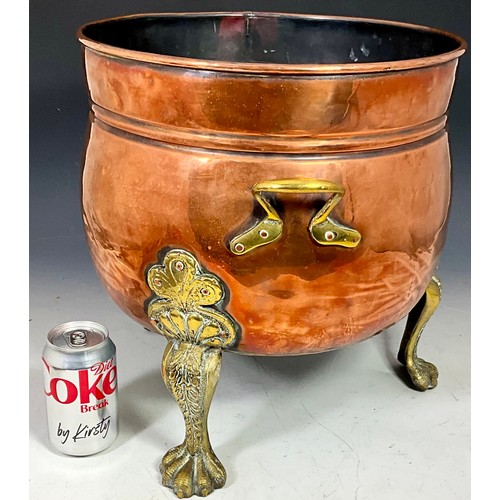 323 - LARGE COPPER COAL SCUTTLE OR PLANTER WITH BRASS HANDLES ON BRASS TRIPOD CLAW FEET WITH SCROLLWORK LE... 